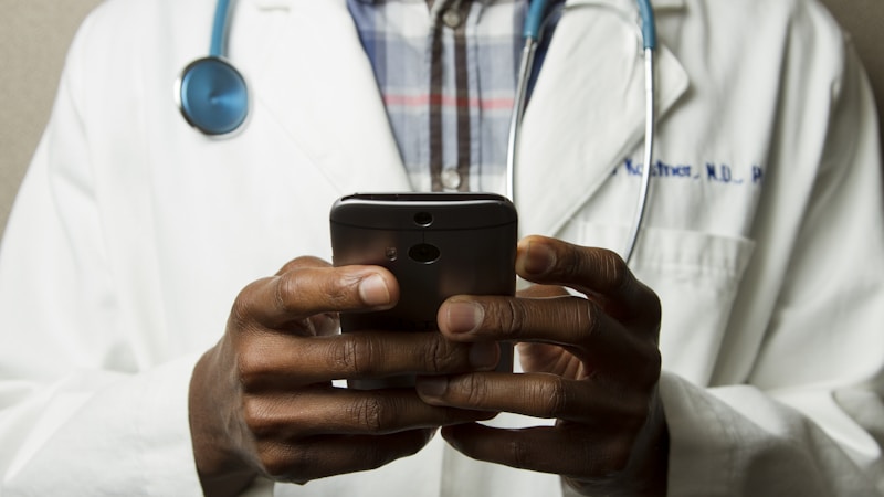 Healthcare professional consulting with a patient about medication options in a clinical setting